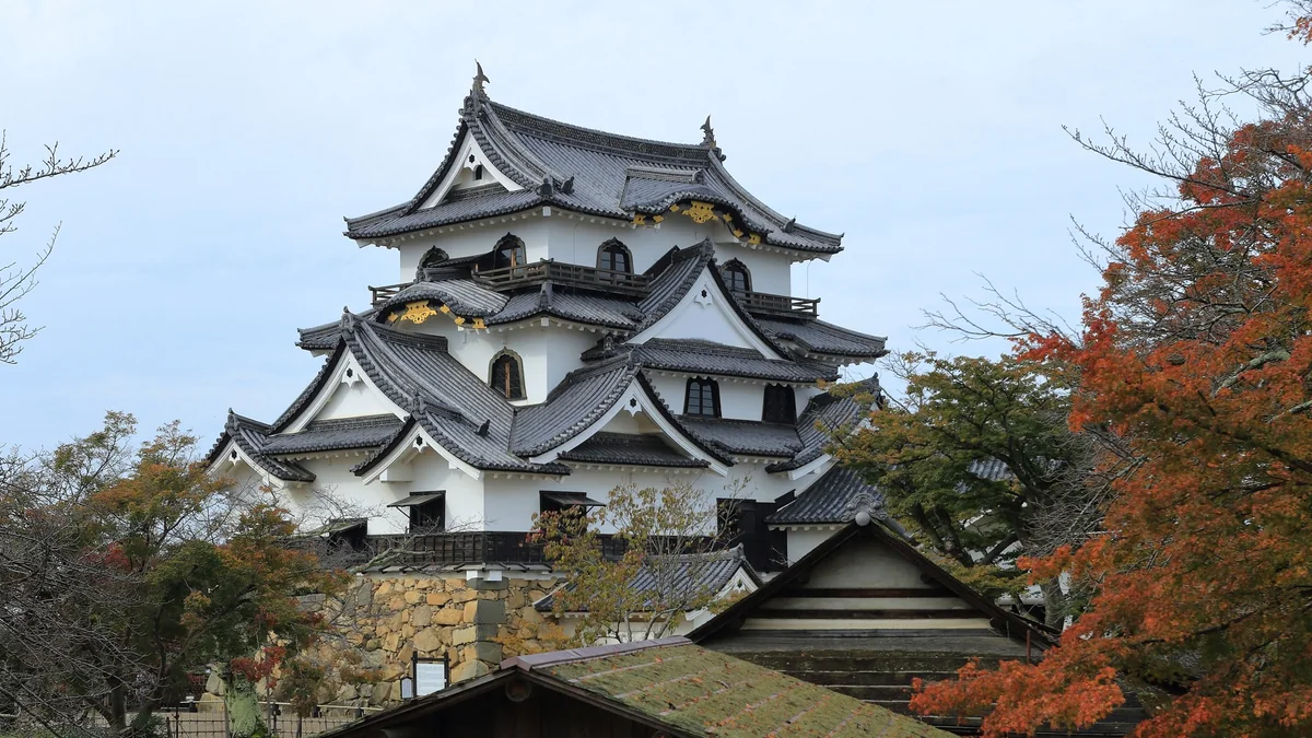 Hikone Castle surrounded by autumn foliage in Shiga