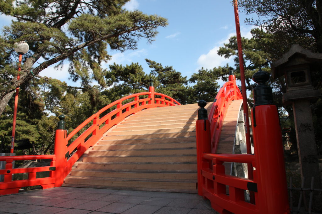Steep steps of the vermilion Sorihashi Bridge at Sumiyoshi Taisha
