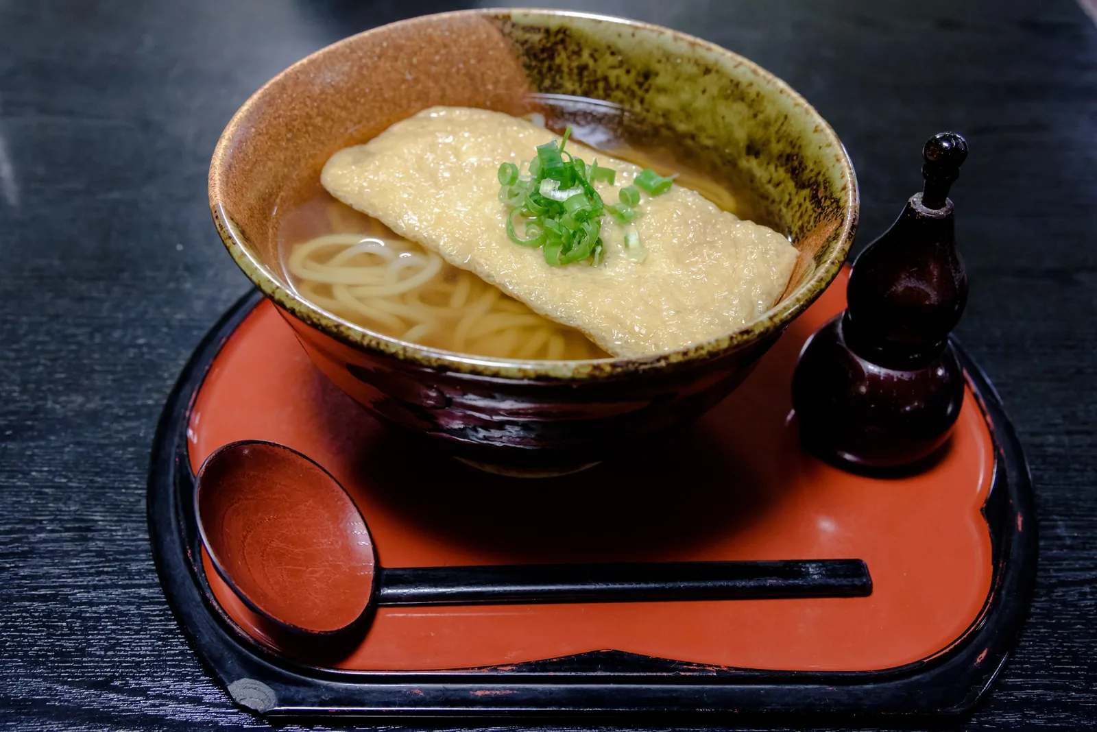 Kitsune udon topped with a large piece of sweet fried tofu