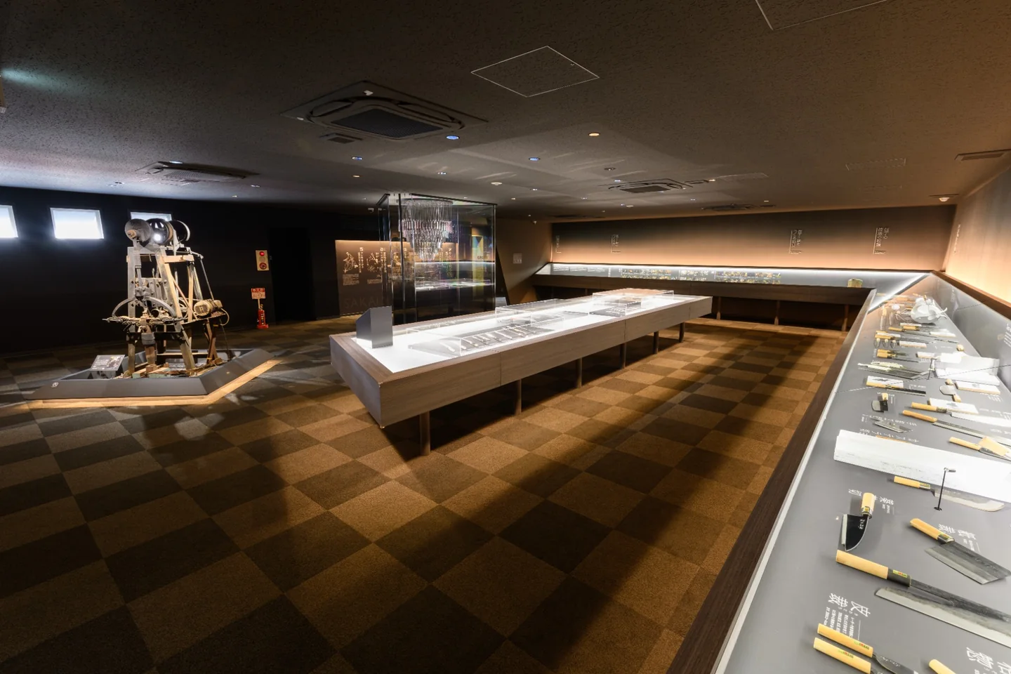 Sakai knife-making tools and blades displayed inside Sakai Denshokan