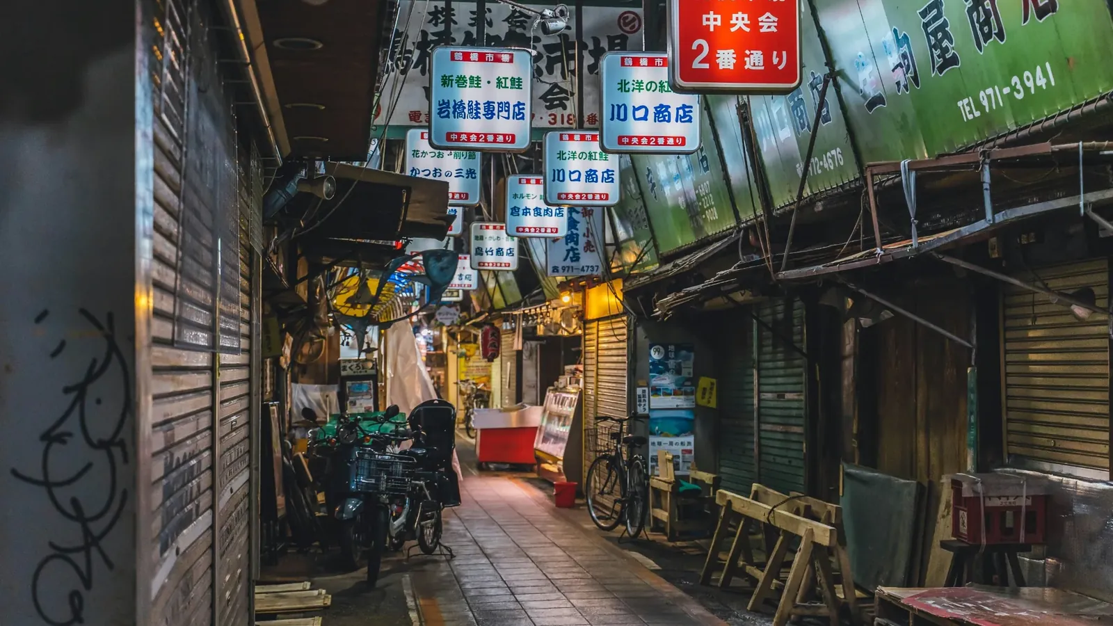 Narrow covered alley inside Tsuruhashi Market in Osaka