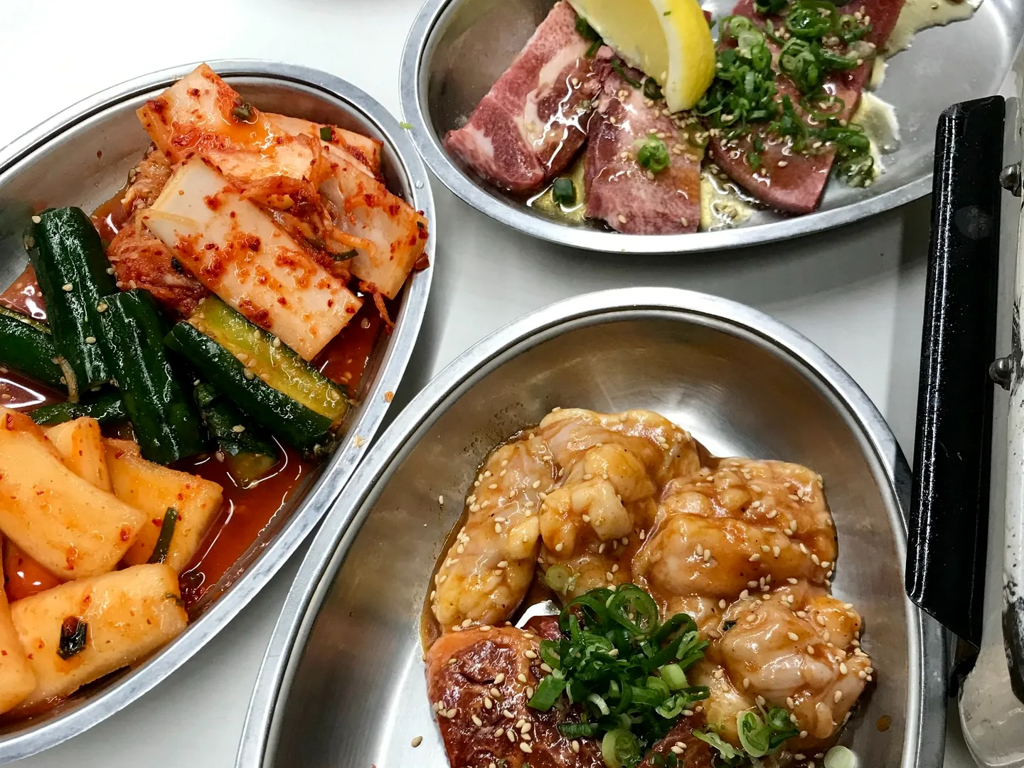 Assorted yakiniku meat, horumon and kimchi served in Tsuruhashi