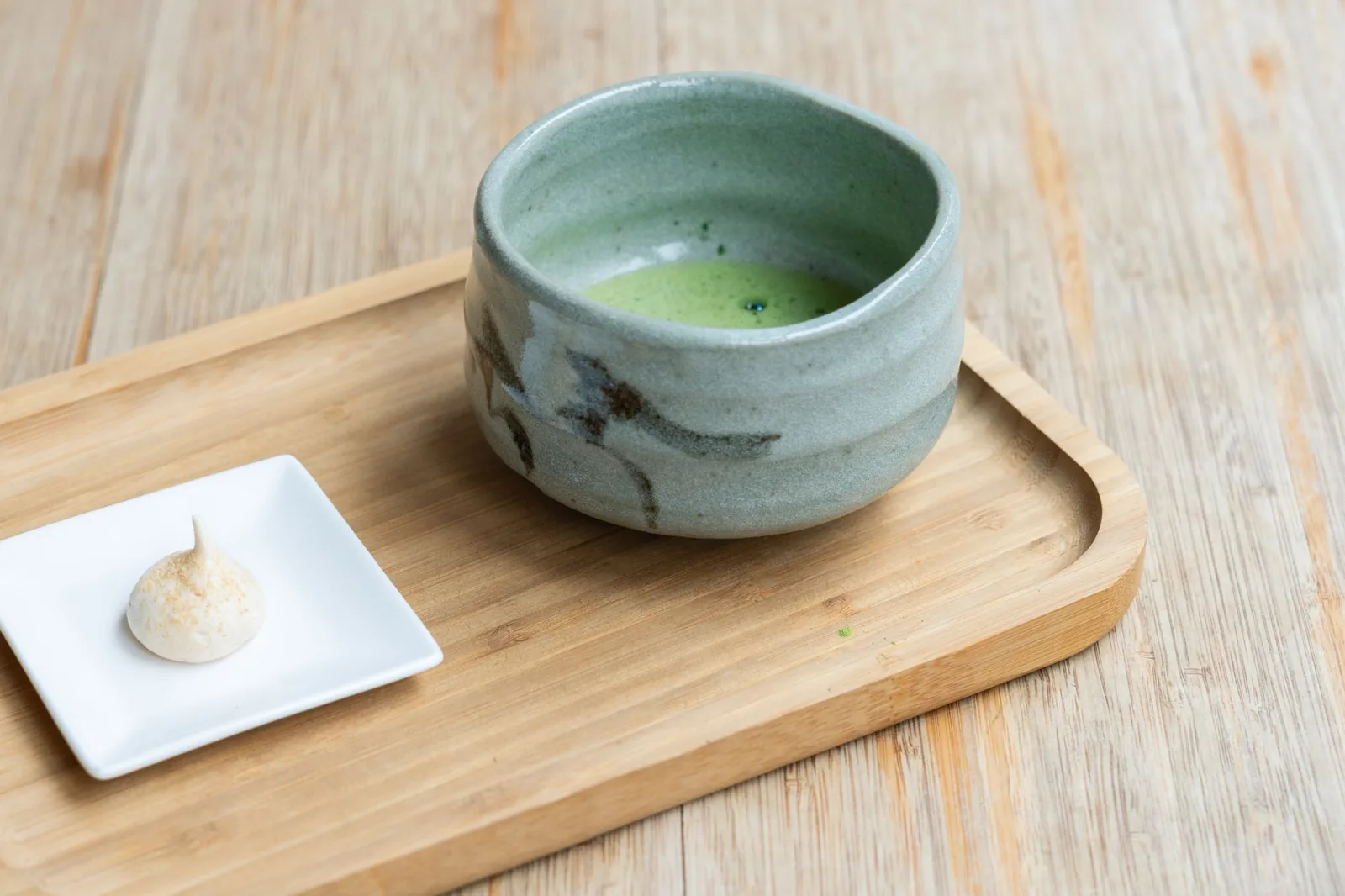 Freshly prepared matcha served in a ceramic tea bowl