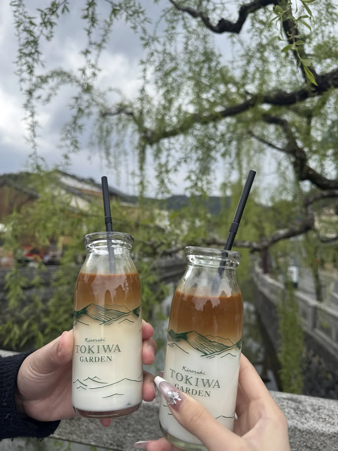 Coffee milk drinks enjoyed beside the willow-lined canal in Kinosaki Onsen