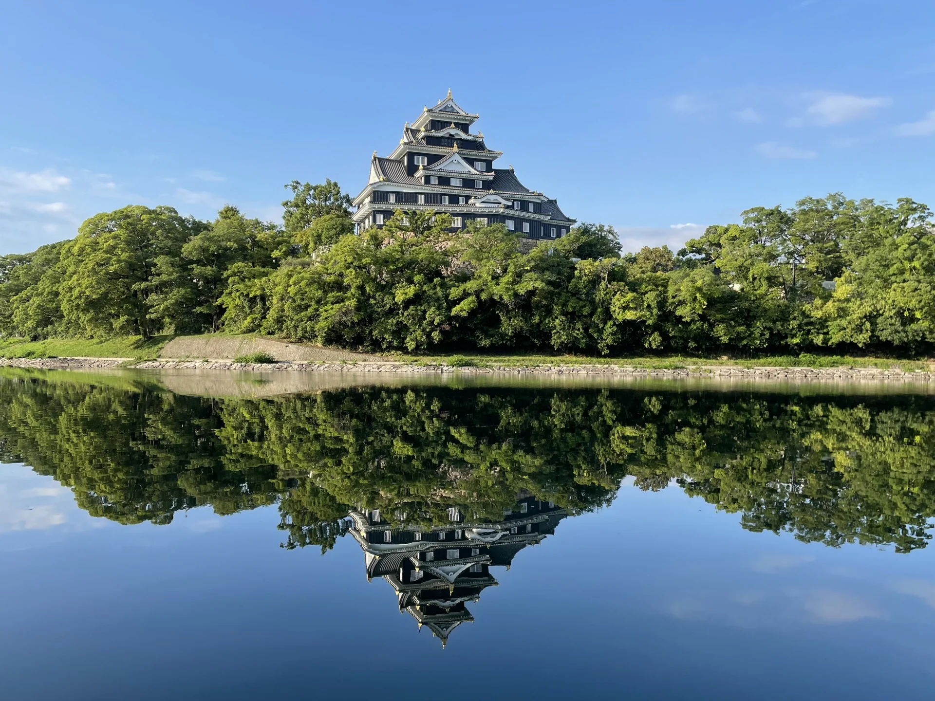 Okayama Castle reflected in the water in Okayama, Japan