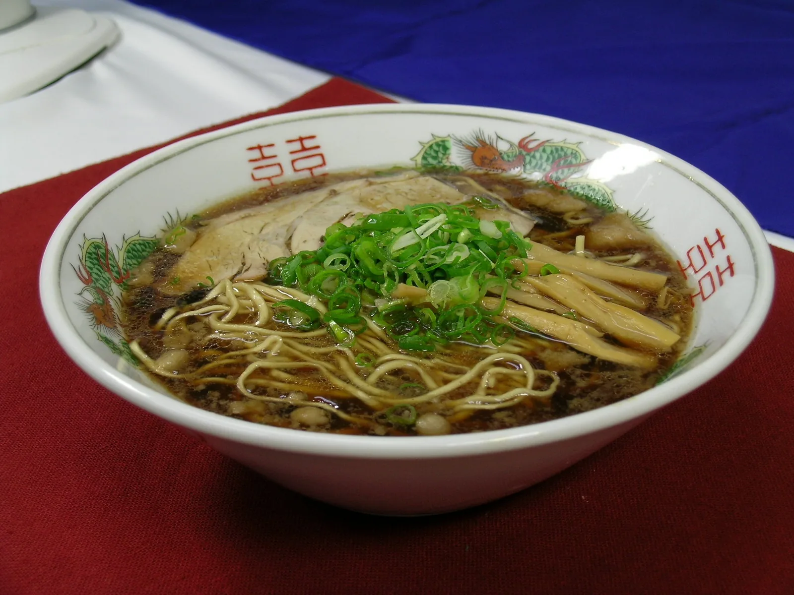 Bowl of Onomichi ramen with soy sauce broth and pork back fat